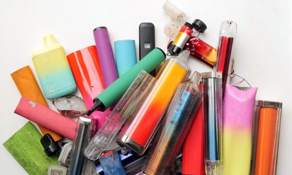 Discarded disposable vapes and rubbish have been seen across the shopfront of Max Convenience. Image: Shutterstock