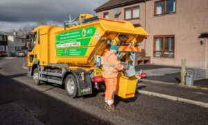 Bin lorry collections rubbish during the festive period.