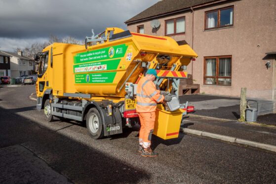 Bin lorry collections rubbish during the festive period.