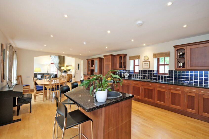 The open plan kitchen, diner and lounge at the house for sale in Oyne