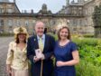 RSABI honorary vice-president Andrew Arbuckle pictured at the Palace of Holyroodhouse with daughters Lydia, left, and Elizabeth, right.