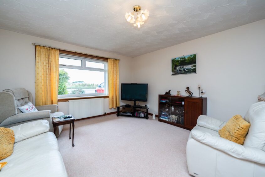 Spacious lounge at Burnside, the house for sale in Longside.