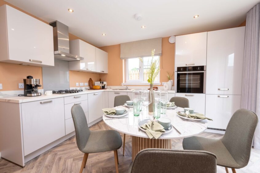 bright and airy kitchen with dining area