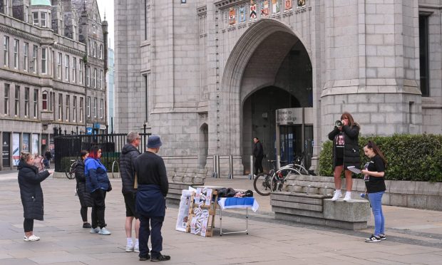 Lynsday-anne Forbes held a protest at Marischal College in her fight for justice. Image: Darrell Benns/DC Thomson