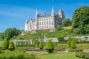 Dunrobin Castle overlooking the green grounds.