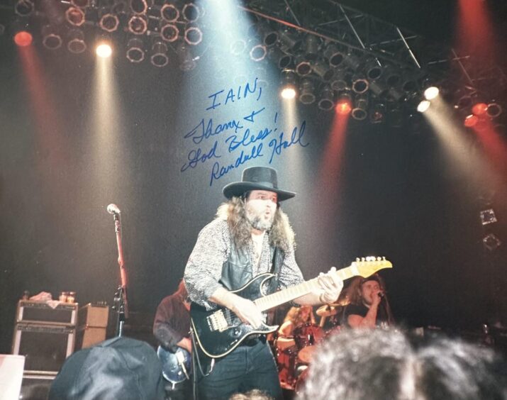 A signed photo from Skynyrd's Randall Hall to superfan Iain Monk of Benbecula. It reads: Iain, thanx and God Bless! Randall Hall.