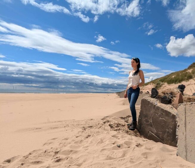 Gayle checks out 'Hitler's Graveyard' on Newburgh beach. Image: Gayle Ritchie. 