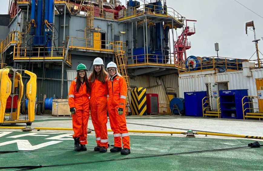 Graduate-level recruit Haley Robertson, on the left, visiting decommissioning support vessel Well-Safe Guardian with colleagues Claire and Lea.