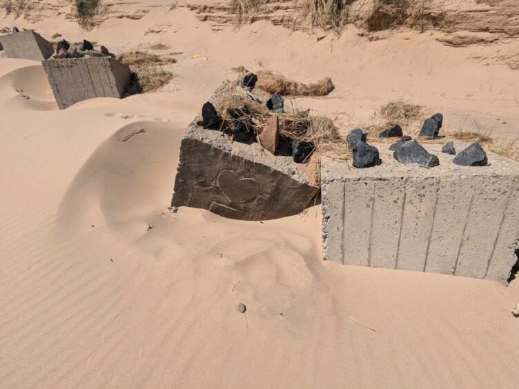 The line of anti-tank blocks at Newburgh beach includes 'Hitler's Graveyard'. Image: Gayle Ritchie.