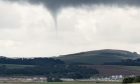 The funnel cloud only becomes a tornado when it reaches the ground. Image: Jack Waterston.