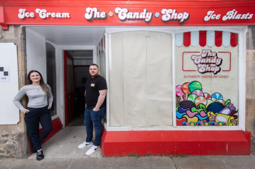 Florian and Vanessa Koci pictured outside the former candy shop in Elgin.