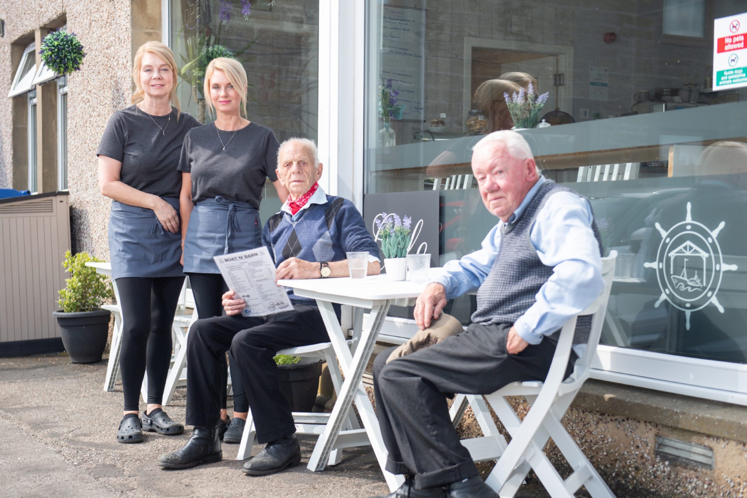 Lynette and Carol with Leslie and Johnny, who are regulars at the cafe in Keith.