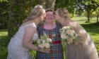 Isabel Lockhart with two brides on their wedding day.