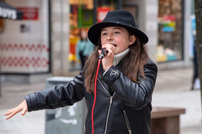 Erin Inglis at Castlegate in Aberdeen busking. 