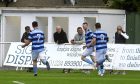 Andy Hunter, centre, celebrates after scoring for Banks o' Dee against Formartine United. Pictures by Kenny Elrick/DCT Media.