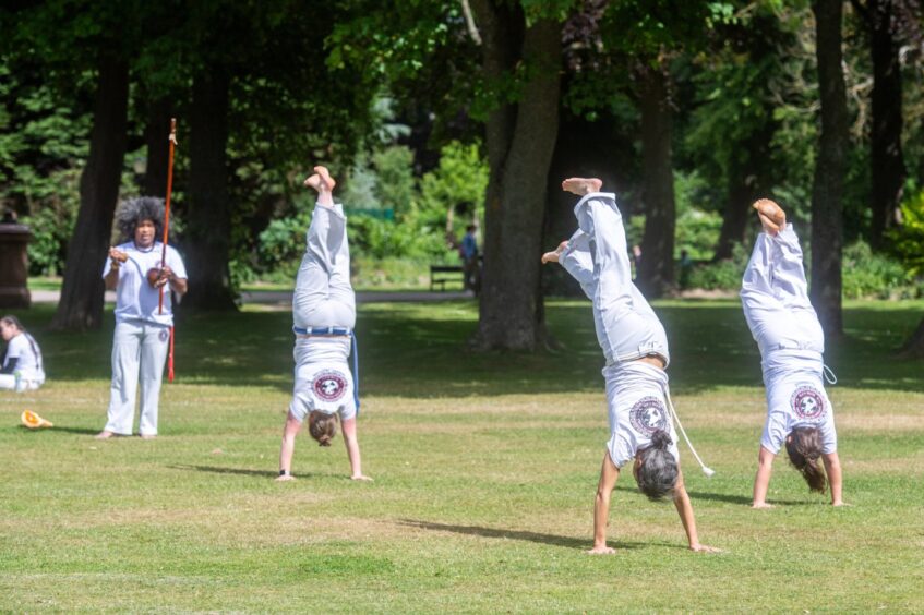 Students doing handstands at the martial arts class held at Duthie Park, Aberdeen.