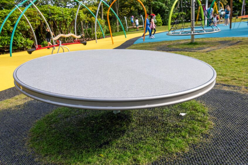 Metal roundabout equipment at Hazlehead Park