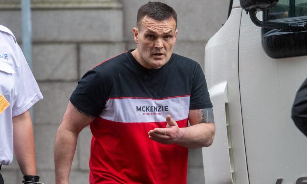 Patrick O'Neill leaves court in custody.