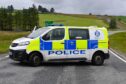 Police at the scene on the A96. Image: Kenny Elrick/DC Thomson