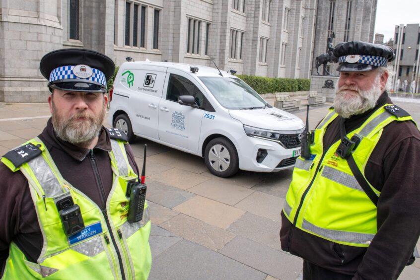 City wardens Scott Thomson (left) and Philip Milne (right) with Aberdeen City Council's new ANPR parking camera van. Image: Kami Thomson/DC Thomson