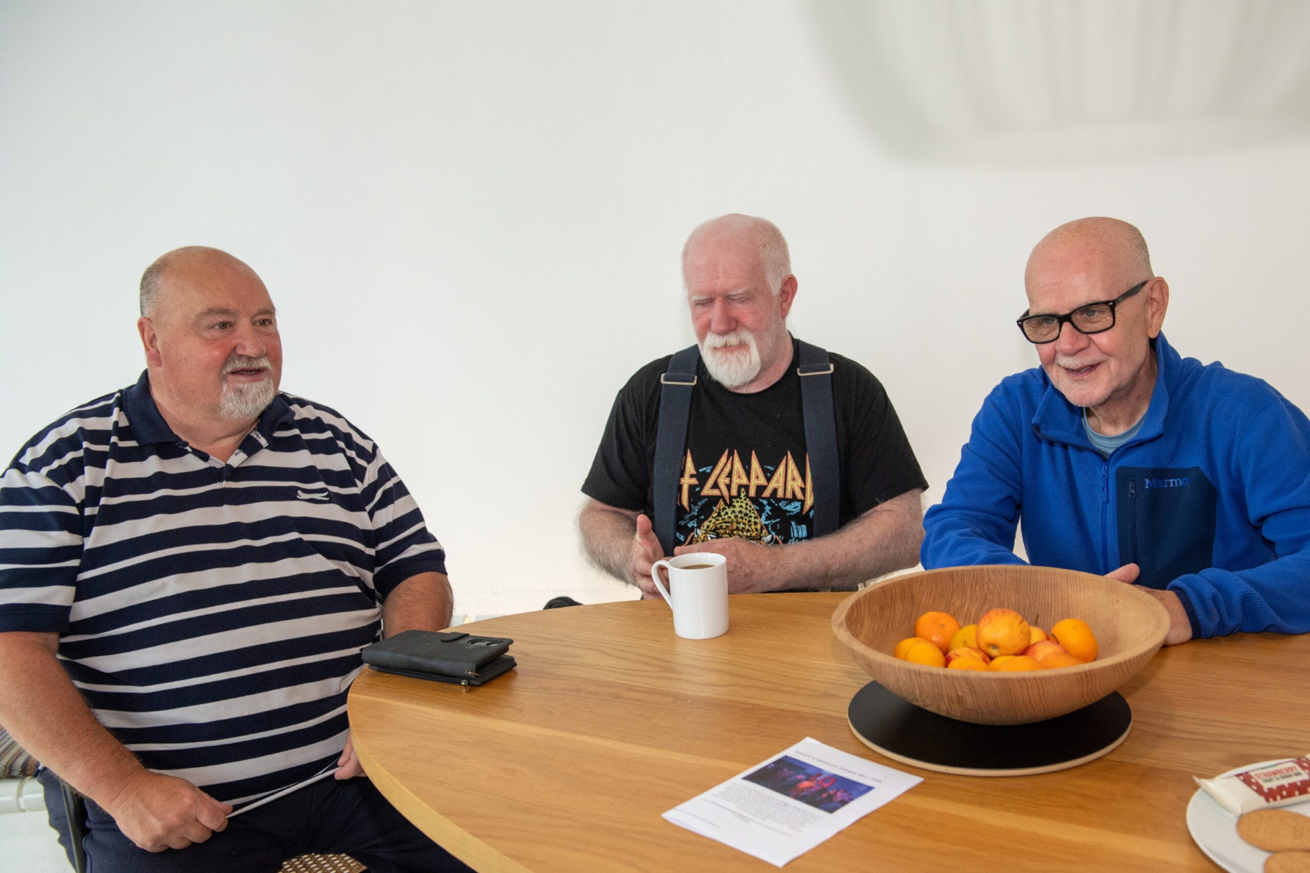 Graham Norrie, Jim Bremner and Dennis Nicol around a table chatting