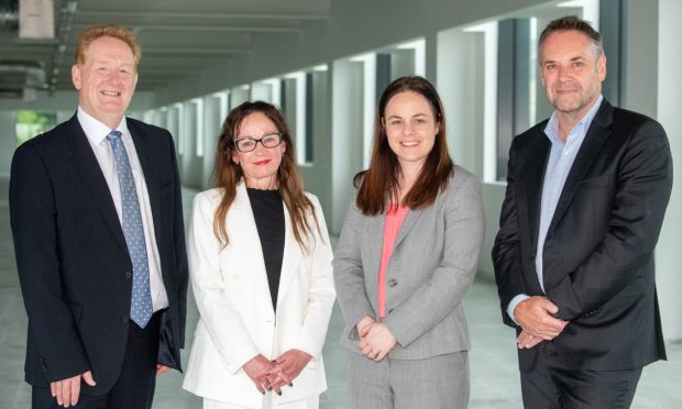 Mark Cook, Scottish Brain Sciences, Dr Deborah O'Neil, chair of the ONE life sciences board, Deputy First Minister Kate Forbes and Craig Ritchie, Scottish Brain Sciences in the new office space.  Image: Kami Thomson/DC Thomson