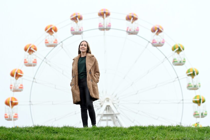 Inverurie nutritionist Laura Leslie stands on a damp-looking Aberdeen beach framed by the big wheel at Codona's.