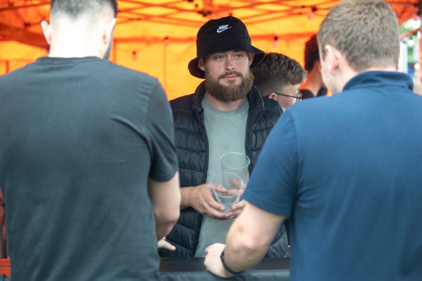 Man serving cider 