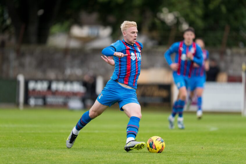 Inverness Caledonian Thistle midfielder Luis Longstaff going on the attack with the ball at his left foot. 