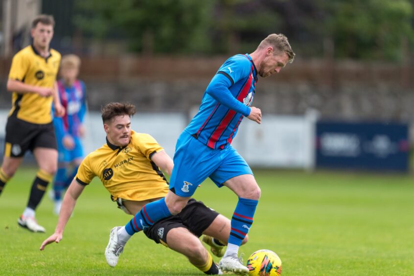 Inverness striker Billy Mckay in action