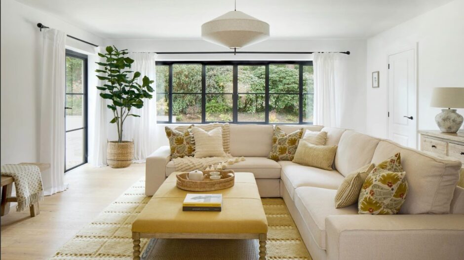 Large open plan sitting room with white and brown furniture