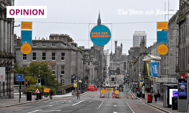 Business as usual signs were put up on Union Street, Aberdeen, to mitigate the impact of roadworks.