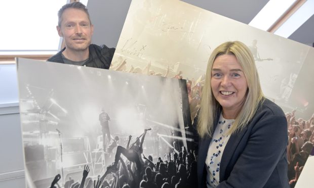 Alex Smith and Caroline Campbell of Ironworks Venue with images of nights at the now closed venue. Image Sandy McCook/DC Thomson