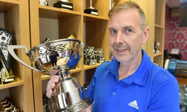 Scott McBride and his wife run the Inverness Trophy Centre which was set up by his father in 1972, Image Sandy McCook/DC Thomson