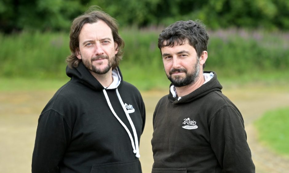 Elgin amateur athletics club coaches looking at camera. 