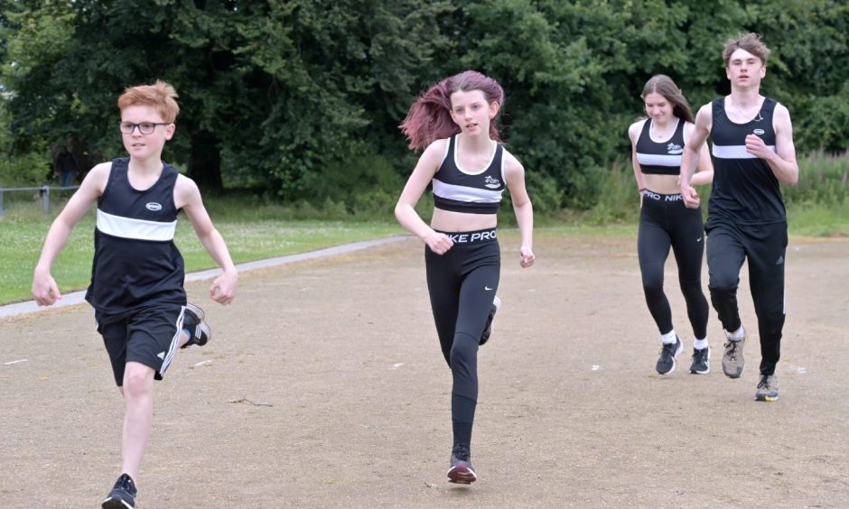 Runners on Elgin running track. 