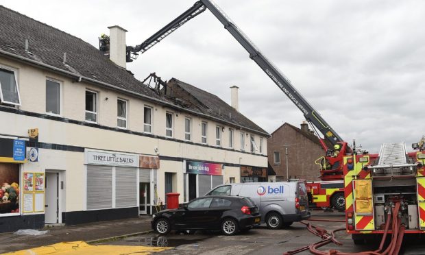 Fire and police remain at the scene of the incident on Tomatin Road.