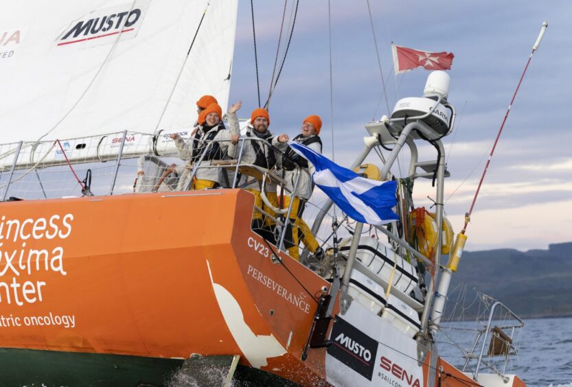 A wave from the Perseverance team as they approach the finish line