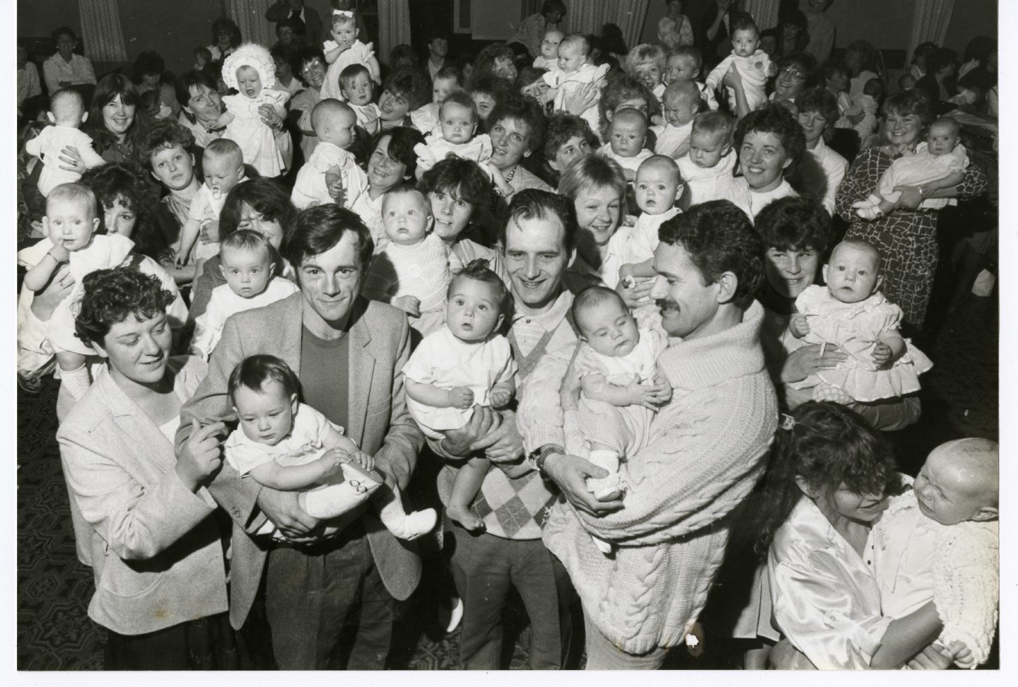 A crowd of women and babies with three fathers who entered into the spirit of things at the Baby Show in Peterhead at the front