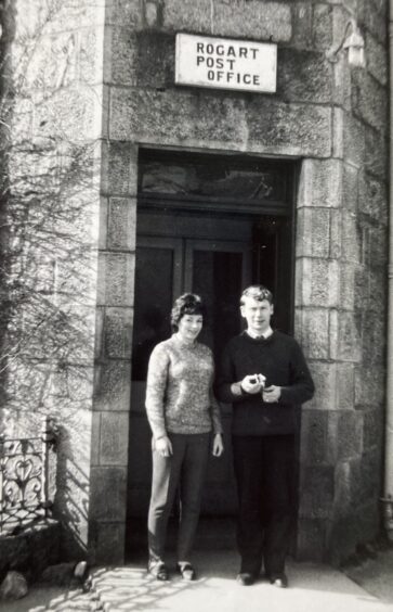 A black ad white picture of postmaster Alisdair Mackenzie and is wife Marjorie outside the original Rogart Post Office . 