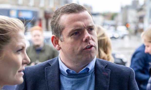 Douglas Ross speaking with activists in Inverurie on Wednesday. Image: Scott Baxter/DC Thomson.
