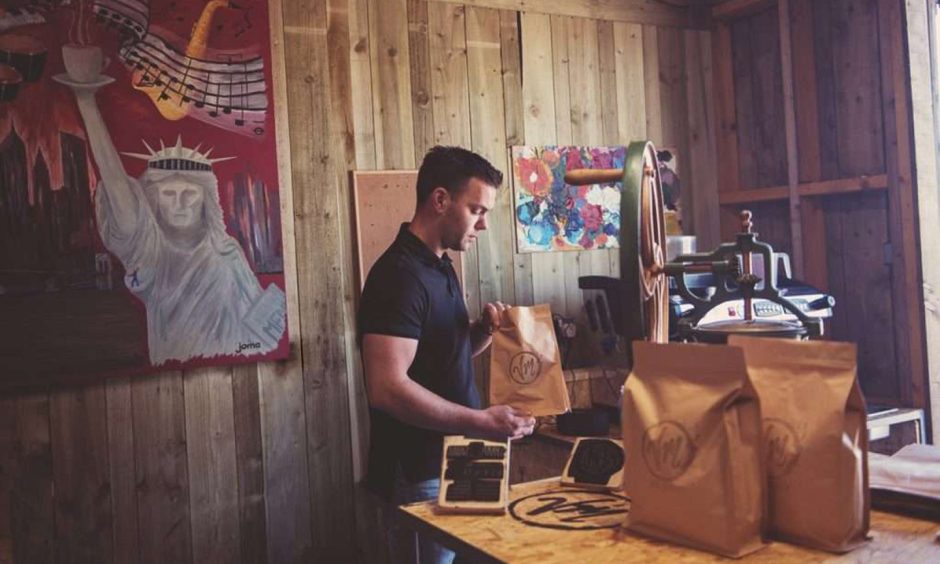 Paul roasting his signature Symposium blend at his Viewmount Roastery. Image: Symposium