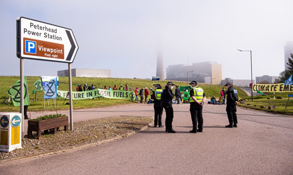 Extinction Rebellion protestors blockade the entrance to Peterhead Power Station in June 2021, ahead of COP26 in Glasgow. 