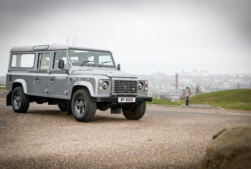 Land Rover Defender Hearse parked in a car park.