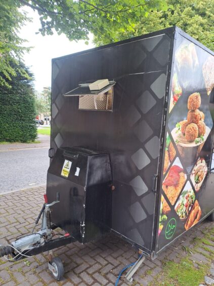 Broken ventilation window at the Inverness food truck.