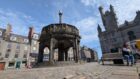 Granite setts and loose slabs make for a tricky walk on the Castlegate. Image: Alastair Gossip/DC Thomson