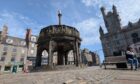 Granite setts and loose slabs make for a tricky walk on the Castlegate. Image: Alastair Gossip/DC Thomson