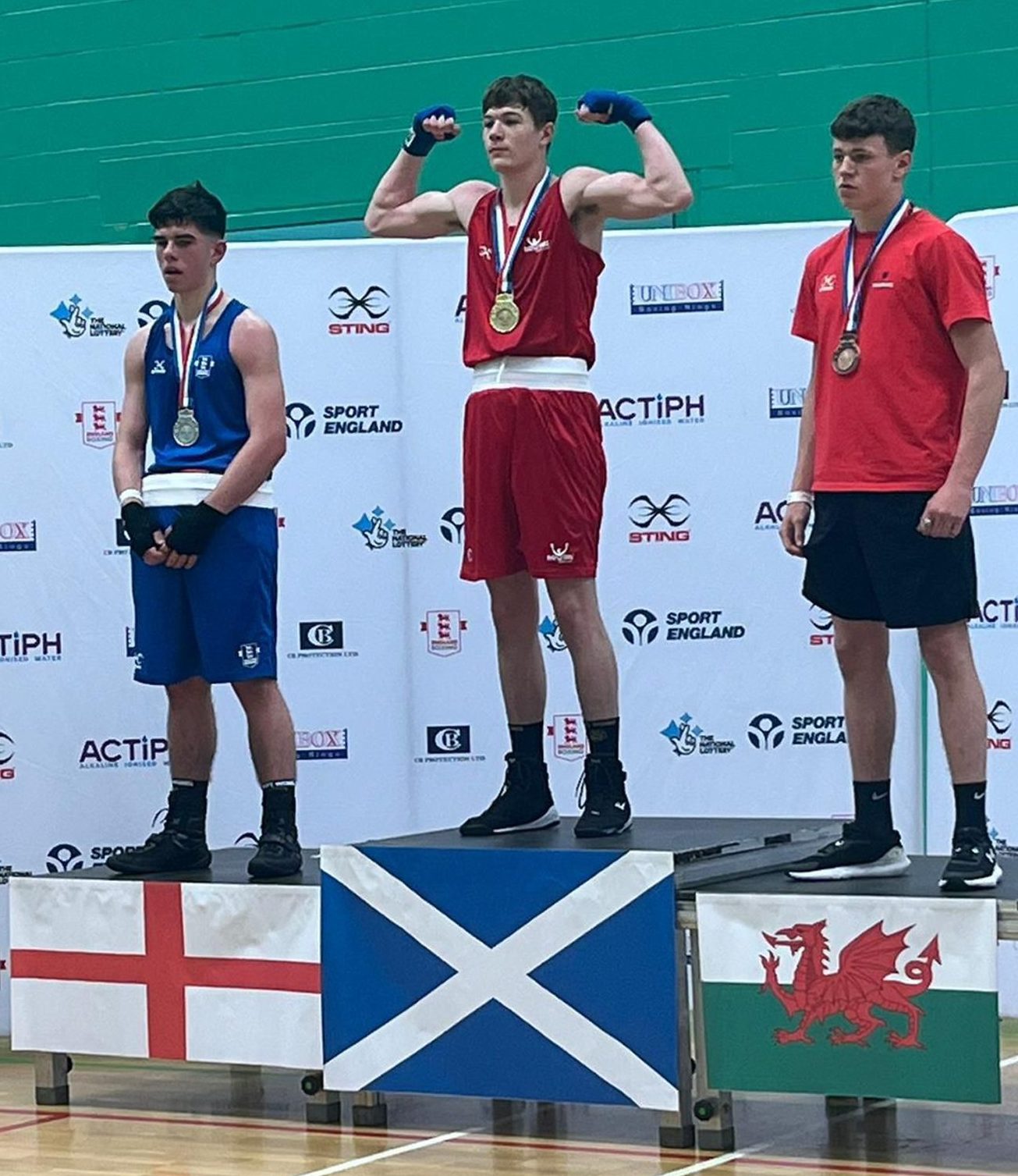 Byron Boxing's Mikey Kahl (centre) tops the podium after winning the British title Image supplied by Byron Boxing Club