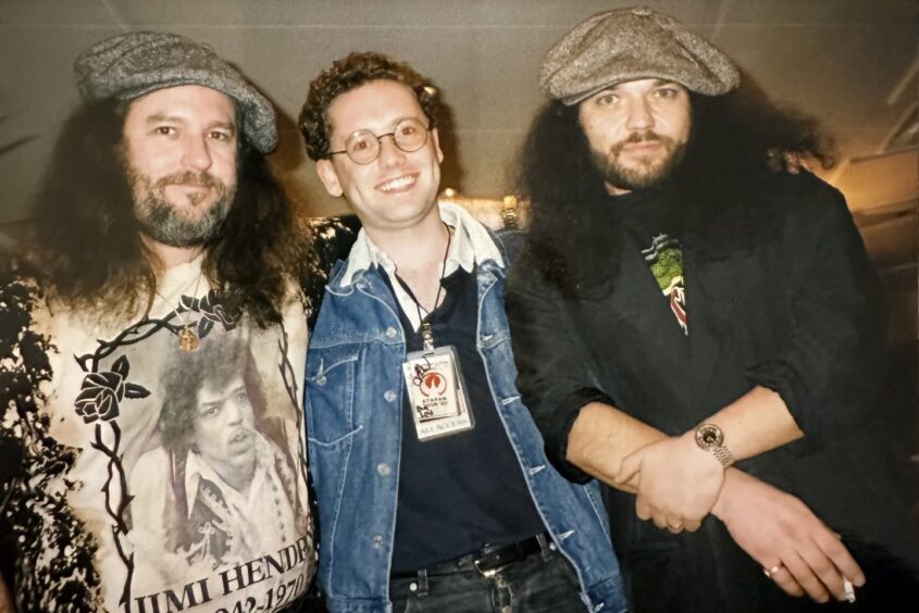 Iain with Skynyrd guitarists Randall Hall, left, and  the late Gary Rossington in 1992. Skynyrd were playing the Hammersmith Odeon and Iain was the only fan allowed backstage.  