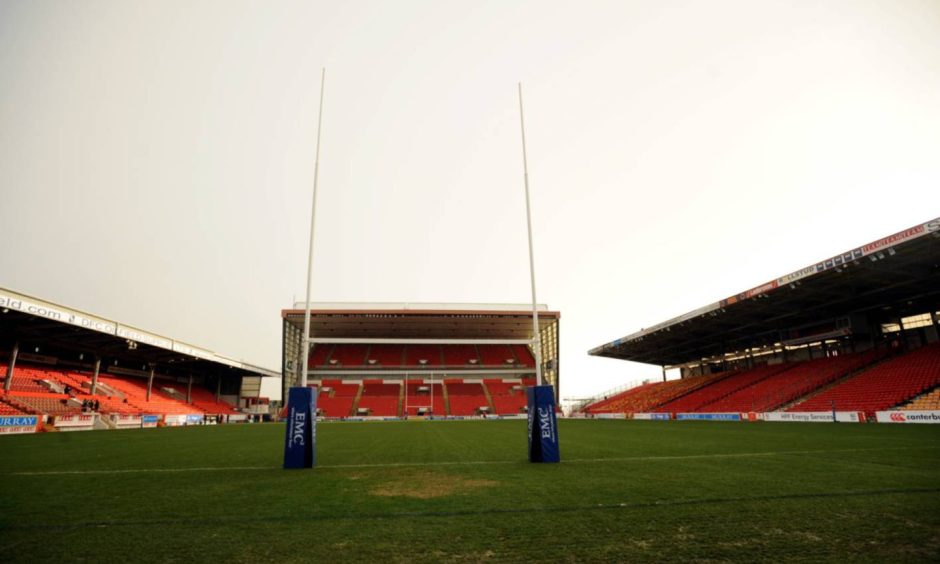 Pittodrie Stadium, Aberdeen, with rugby posts set up on the pitch